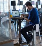 SAP_Concur_Man_Office_Vertical_CoffeeCup-914x999.jpg
