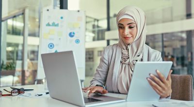 woman_in_conference_room_using_laptop.jpg